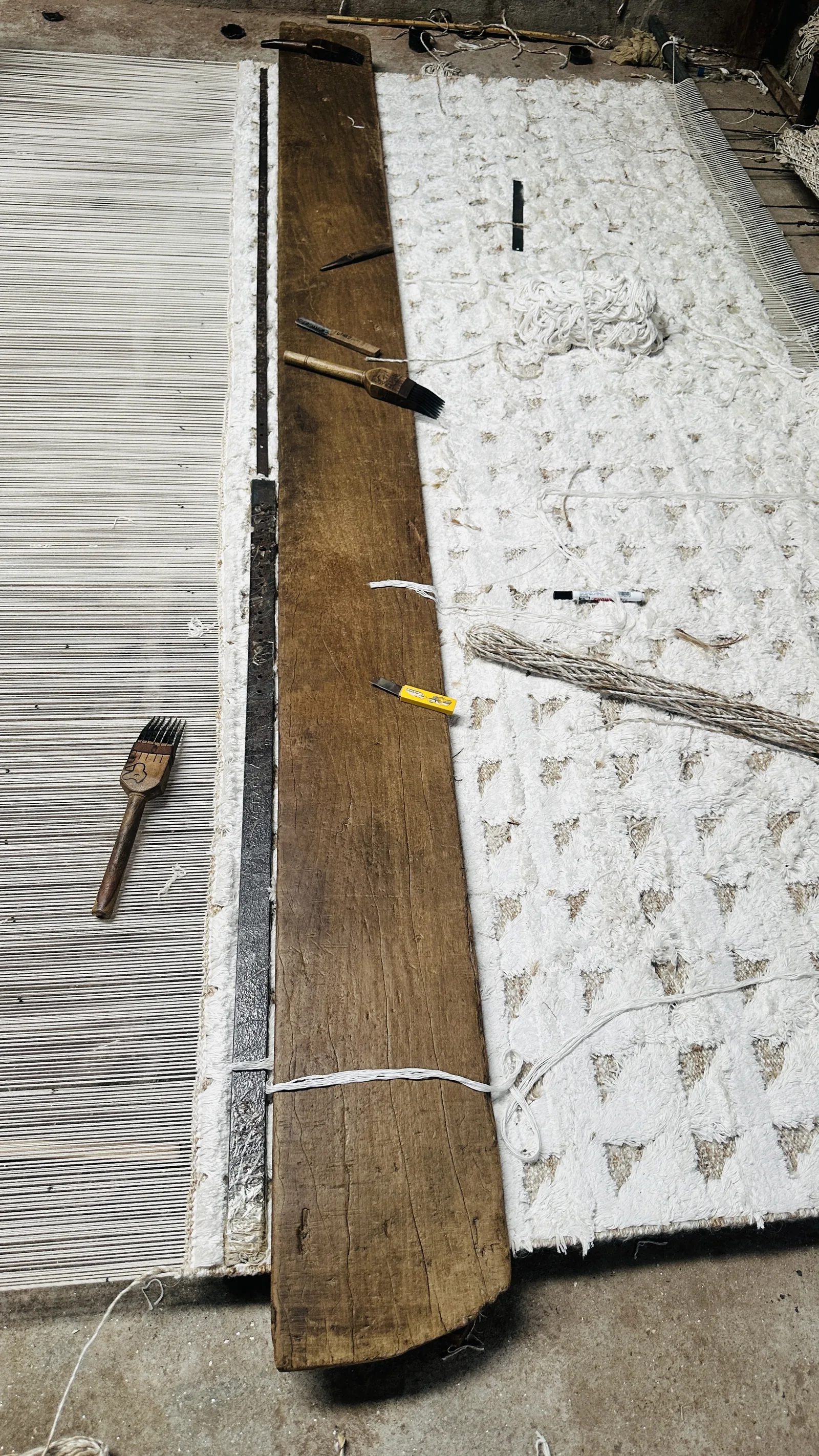 A flatweave rug in progress on the loom at PiHue