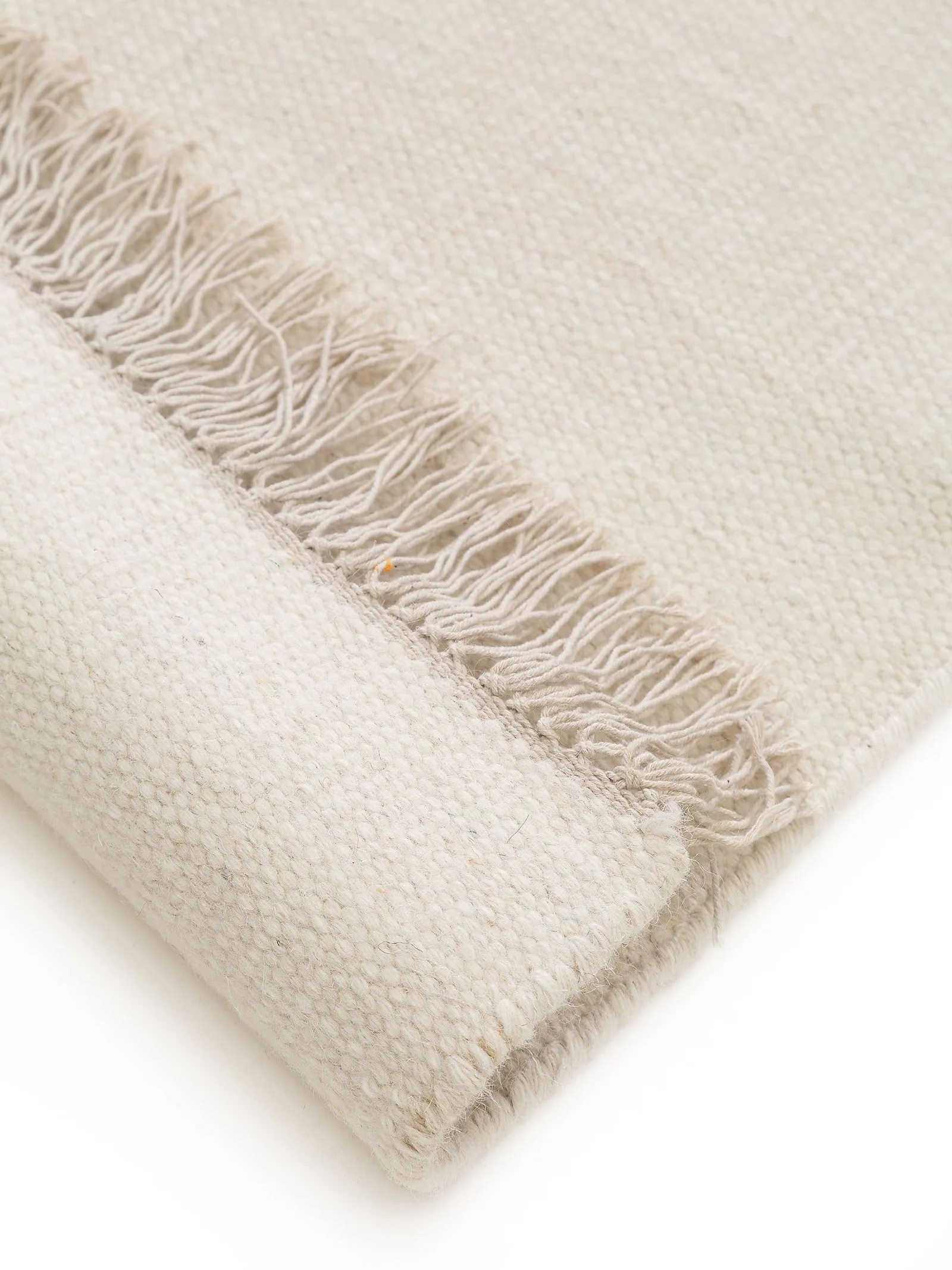 Ivory flatweave rug with cotton fringe detail