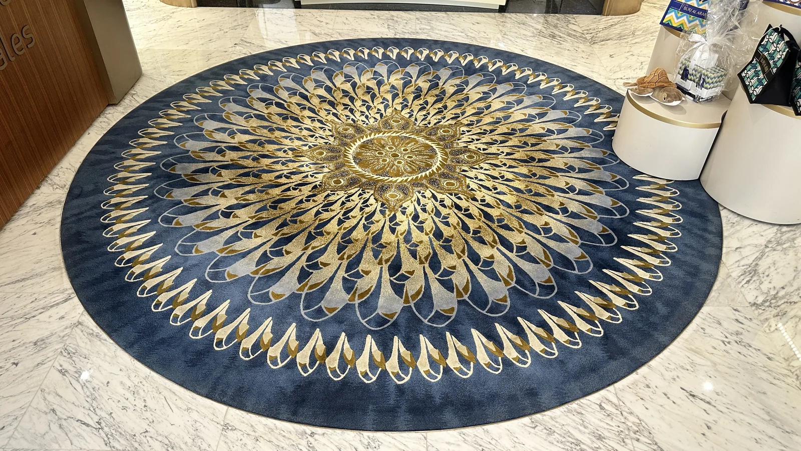 A finished round hand-knotted rug in a hotel lobby at PiHue, Bhadohi