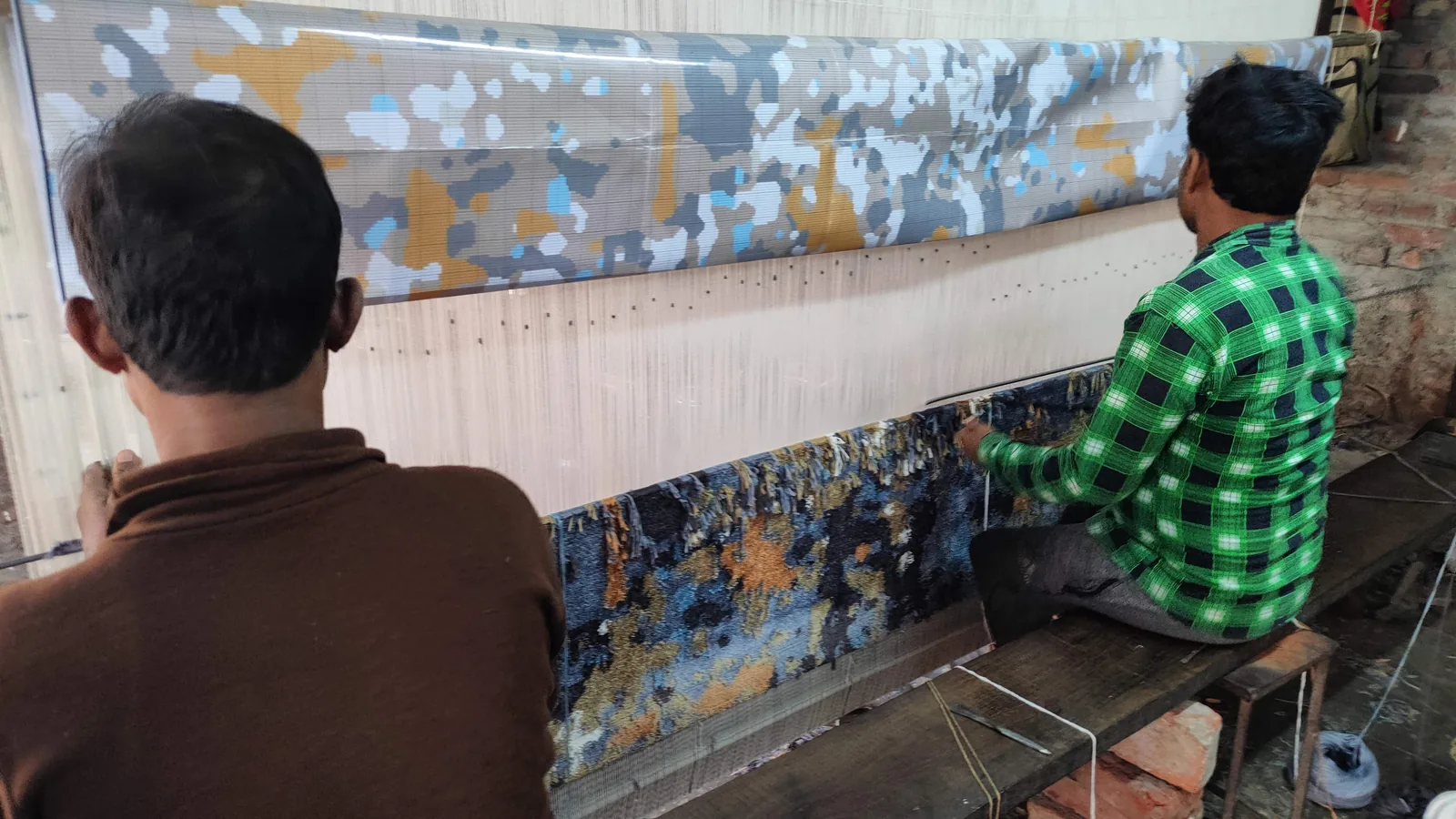 A silk hand-knotted rug being woven at PiHue, Bhadohi